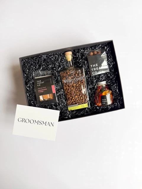 Groomsman gift box with coffee, grooming products and a handwritten card